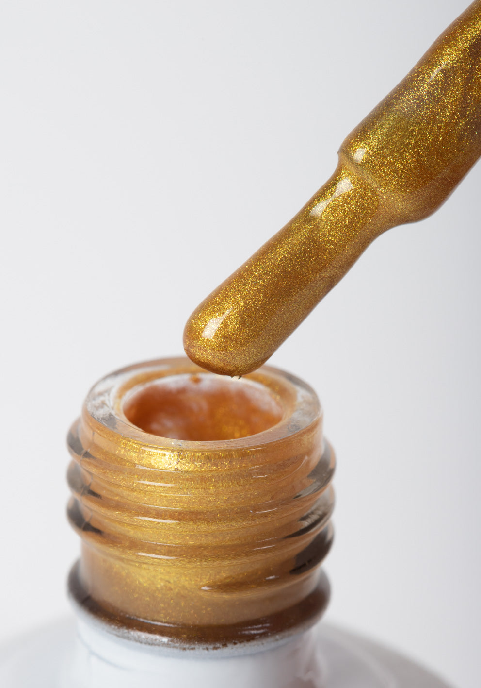 Esmalte semipermanente glitter dorado 14 ml - F016